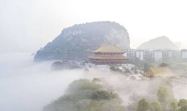 Scenery of advection fog above Liujiang River in Liuzhou, S China