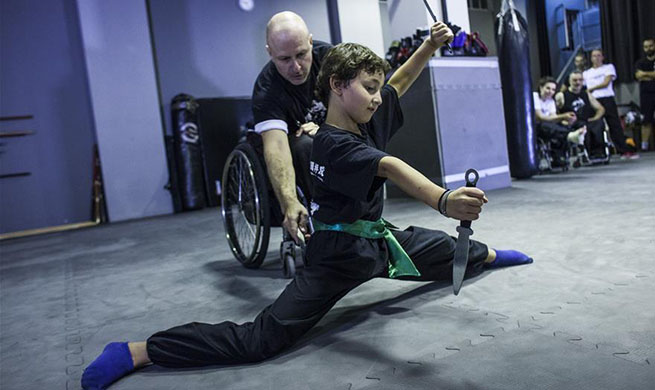 In pics: Wushu teacher in wheelchair in Greece