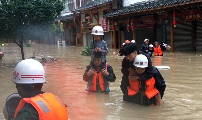 Rescuers evacuate residents as heavy rain hits NW China's Gansu