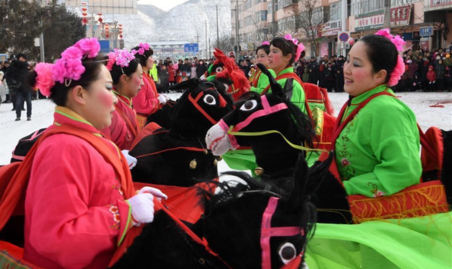 Performers from 11 shehuo teams celebrate upcoming Lantern Festival in China's Gansu