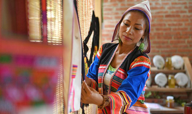 Villager of Jino ethnic group in China's Yunnan operates homestay tourism to increase income