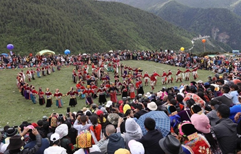 Local people attend ritual on Siguniang Mountain, SW China