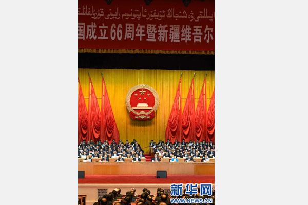 10月1日，慶祝中華人民共和國成立66周年暨新疆維吾爾自治區(qū)成立60周年大會在新疆人民會堂隆重舉行。 新華社記者 高潔 攝 
