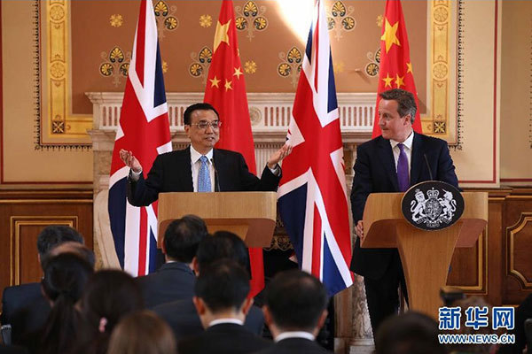     6月17日，國務院總理李克強同英國首相卡梅倫在倫敦舉行中英總理年度會晤后共同會見記者。 新華社記者 龐興雷 攝 